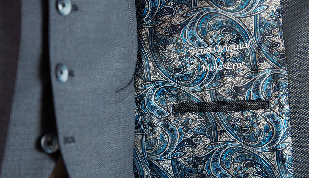 Patterned inside lining of a fitted suit jacket.
