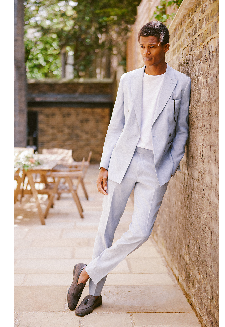 Man in lightweight grey summer wedding suit and white t-shirt