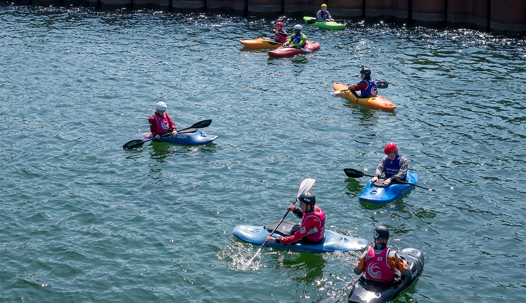 Men on a summer stag do white water rafting in Cardiff.