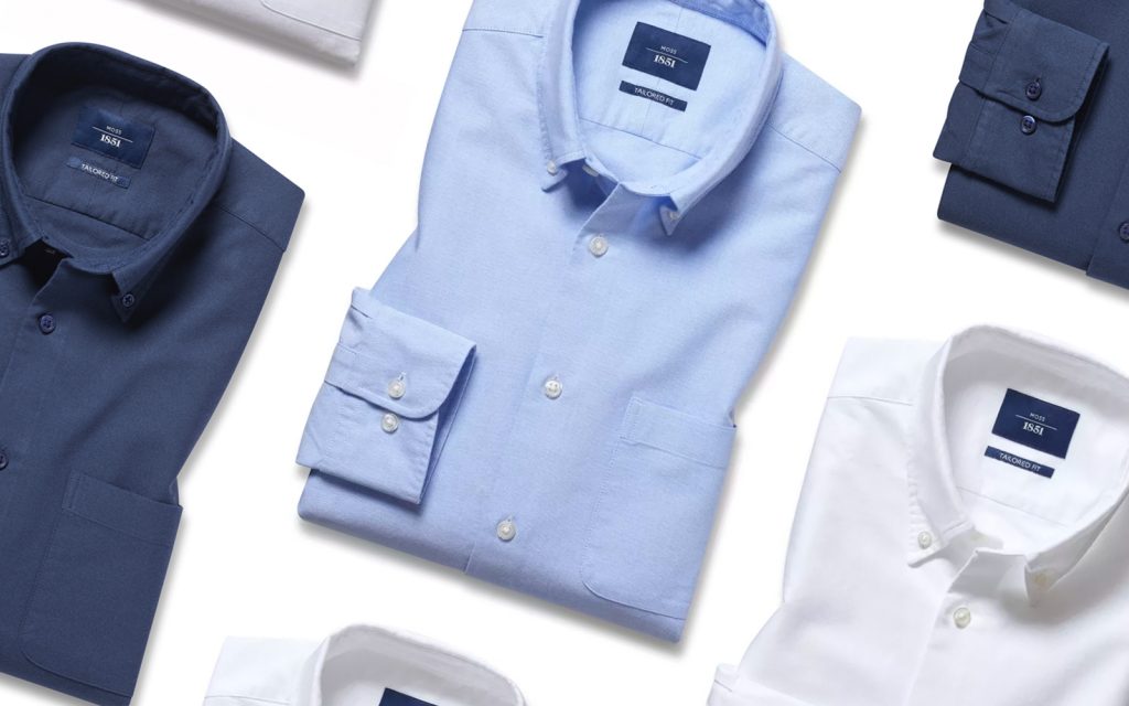 A row of Moss Bros Oxford shirts in various colours. 