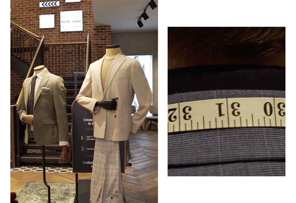 Man buying a dark blue suit standing in a Moss Bros fitting room.